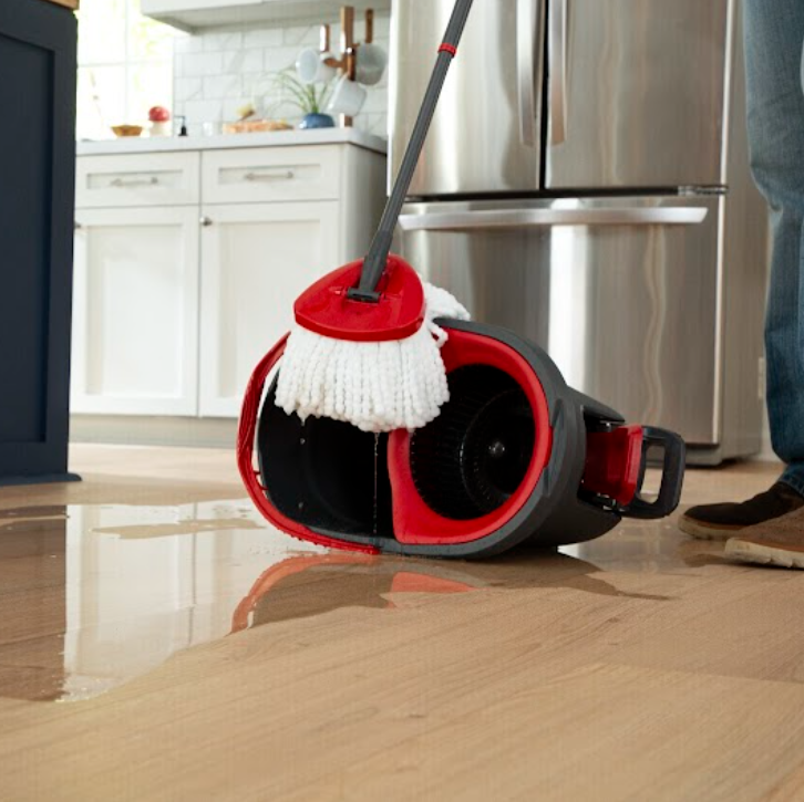 Mopping a durable SolidTech R floor in a kitchen
